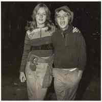 B+W photo of two teenage girls probably at a football game, Hoboken, no date, [1976].