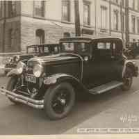 View of a 1931 Buick automobile on Newark Street with Hoboken City Hall in background, Hoboken, April 12, 1931.