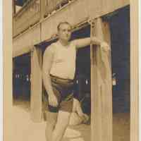 Sepia-tone photo of Allan W. Moore in bathing trunks on beach, probably Atlantic City, N.J., n.d., ca. 1915-1918.