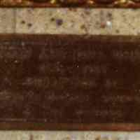          detail of plaque beneath portrait (not legible)
   