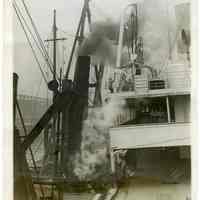 B+W photo of S.S. Veendam being raised after sinking at dock due to harbor collision, Hoboken, ca. May 21-23, 1928.