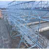 Color photo of back of Maxwell House Coffee sign support structure & rooftop, Hoboken, n.d, ca. 2000.