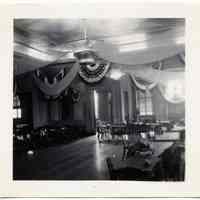 B+W photo of a hall decorated with bunting by United Decorating Co. of Hoboken, Hoboken?, n.d., ca. 1935-1950.