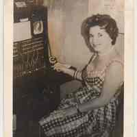          photo 1: Marie Feroldi at telephone switchboard.
   