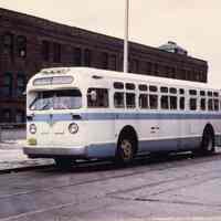 Color photo of the Washington Street bus at Hudson Place bus stop, Hoboken, (1927.)