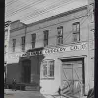 B&W photo of commercial building at 305-307 Grand Street, Hoboken.