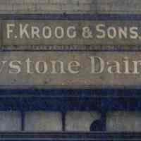          detail right: signs over garage entrance
   