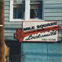 Color photo of wall sign for Mile Square Locksmith, 409 Jefferson Street, Hoboken, Jan. 3 & 4, 2002.