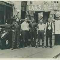 B+W photo of 5 men on the sidewalk at the Model Garage, 214 Clinton St., Hoboken, no date, ca. 1935.