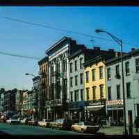          Color slide of eye-level view from the SE corner of Washington & 5th looking S at storefronts picture number 1
   