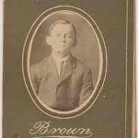 Sepia-tone photo of an unidentified boy posed in studio, Hoboken, no date, ca. 1890-1910.