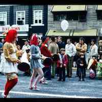 Color slide of three women walking in a parade.