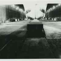 Group of 3 B+W photos with night views of drydock no. 4 at the Bethlehem Steel Shipyard, Hoboken Division, July 6, 1959.