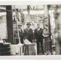 Photograph of Interior of the Hoboken Individual Laundry with four people
