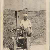 Digital image of B+W photo of Raffaele Gallo with a harness bench in backyard of 509 Monroe St., Hoboken, no date, ca. 1915-1930.