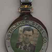          badge, front
   