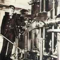 Color copy photo of photo of the chief engineer in the S.S. Ticonderoga engine room, no place, no date, ca. 1900.