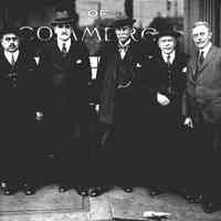 B+W group photo of Sir Thomas Lipton & 4 other members of the Hoboken Chamber of Commerce as Lipton was made a member, Nov. 21, 1919.