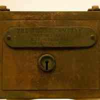 Steel bank with handle: from plate that reads "The Trust Company of New Jersey, 12 & 14 Hudson Place, Hoboken, N.J.," Hoboken, no date, ca. 1910-1950.