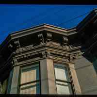          Color slide of close-up view of cornice, brackets, frieze and bay window on a building at an unidentified location picture number 1
   