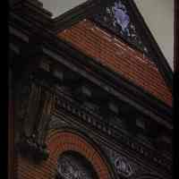 Color slide of detail view of pediment, cornice, bracket, dentils and brick semicircular arches at 814 Willow between 8th and 9th