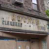 Color photos, 2, of the remains of a sign for Ralph