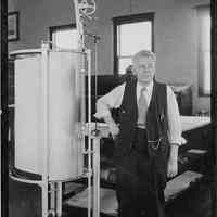 B+W photo of worker in drafting room next to drawing duplicator, United Dry Dock Co., Hoboken, 1931.