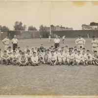 B+W photo of a large group of young baseball players posed on a ballfield, Hoboken, circa 1947-1950.