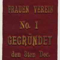 Ribbon badge: Hoboken Frauen Verein No. 1 Gegrundet den 8ten(sic) Dec. 1872.