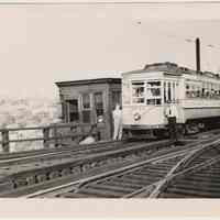 B+W photo of trolley car 2733 on trestle at Jersey City Heights on last full day with signs, Hoboken, Aug. 6, 1949