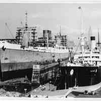 B+W photo of an unknown ship in dry dock no. 2; the S.S. Picone berthed south, Hoboken, no date, ca. 1940.