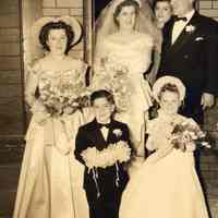 Digital image of sepia-tone photo of a wedding party at front entrance of 509 Monroe St., Hoboken, no date, ca. 1940-1950.