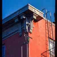 Color slide of detail view of cornice, brackets, frieze and fire escape at 155 6th between Bloomfield and Garden