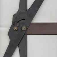          adjustable head shown at an angle; maker's marks to right.
   