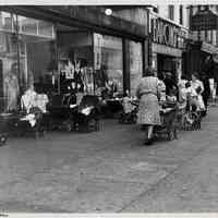 B+W photo of 412-418 Washington St. stores with women, children & baby carriages, Hoboken, 1946.