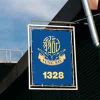 Color photo of the hanging sign of Yung Kee Trading & Real Evergreen Intl., 1328 Madison St., Hoboken, Jan. 3 & 4, 2002.