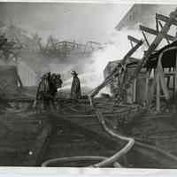 B+W photo of firemen at destroyed warehouse near Holland America Line, 5th & 6th Sts., Hoboken, Nov. 6, 1931.