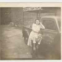 Digital image of b+w photo of a Lucy Principe & unknown boy with Lemon Ice & Yum Yum truck, 416 Clinton St., Hoboken, n.d., ca. 1950s.