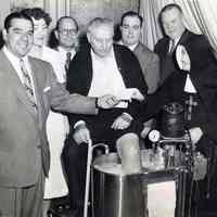 B+W photo of a ceremony in a new whirlpool treatment room at St. Mary