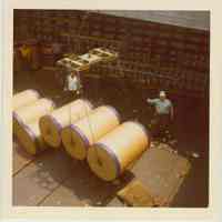 Image: color photo of two longshoremen working in a cargo hold, Hoboken, no date, ca. 1970.