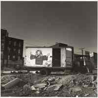 B+W photo of truck with Christ portrait painted on the side in demolished lot, Hoboken, no date, [1976].