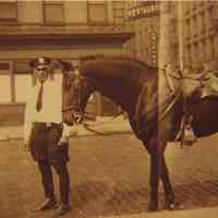 Sepia-tone photo of unknown mounted police officer with horse, River St. near 2nd St., Hoboken, n.d., ca. 1941.