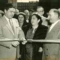 B+W photo of Mayor John Grogan cutting the ribbon at the Grand Opening of Marcus Jewelers, Hoboken, April 3, 1954.