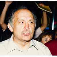 Color photo of mayoral candidate Tom Vezzetti on the street with supporters on election night, Hoboken, [June 11, 1985].