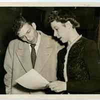 Sinatra photo: Frank Sinatra reviewing document with Chief Clerk at Local Draft Board No. 3, 160 Danforth St., Jersey City , N.J. Dec. 9, 1943.