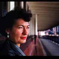 Color slide of a women sitting on a bench.