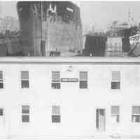 B+W photo of the Yard Office with the S.S. Warrior in a dry dock, Hoboken, no date, ca 1940.