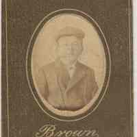 Sepia-tone photo of an unidentified boy posed in studio, Hoboken, no date, ca. 1890-1910.