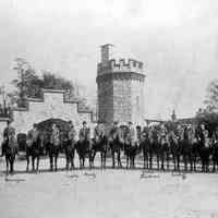 B+W photo of Hoboken Riding Club members on horseback in front of Stevens Gatehouse, 6th St. and Castle Point, ca. 1904.