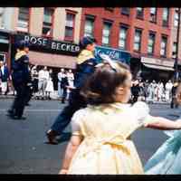 Color slide of two boys walking in a parade.